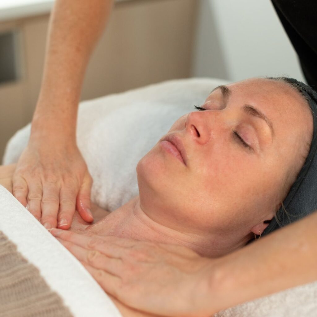woman receiving massage by therapist