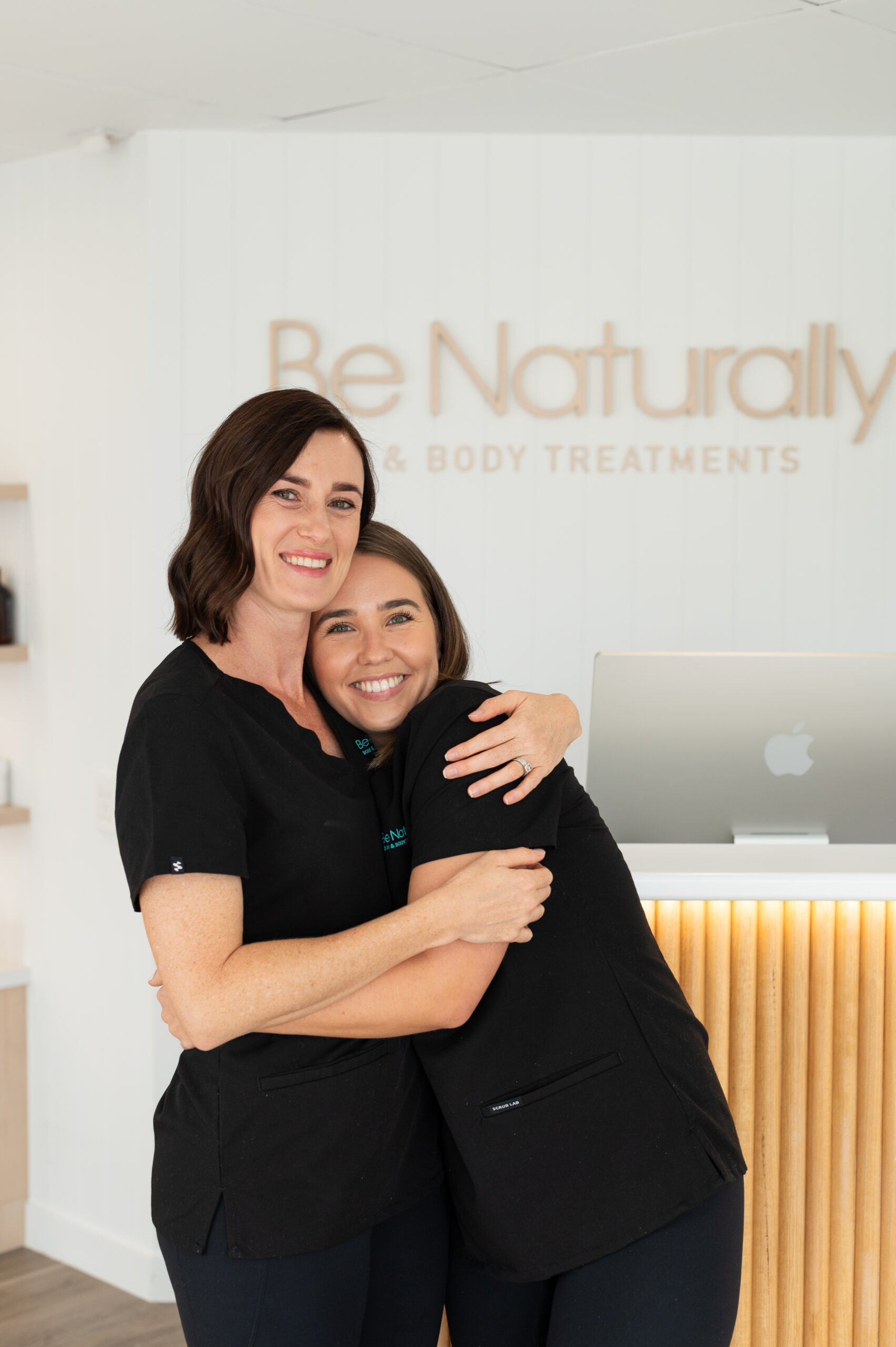 two women hugging each other