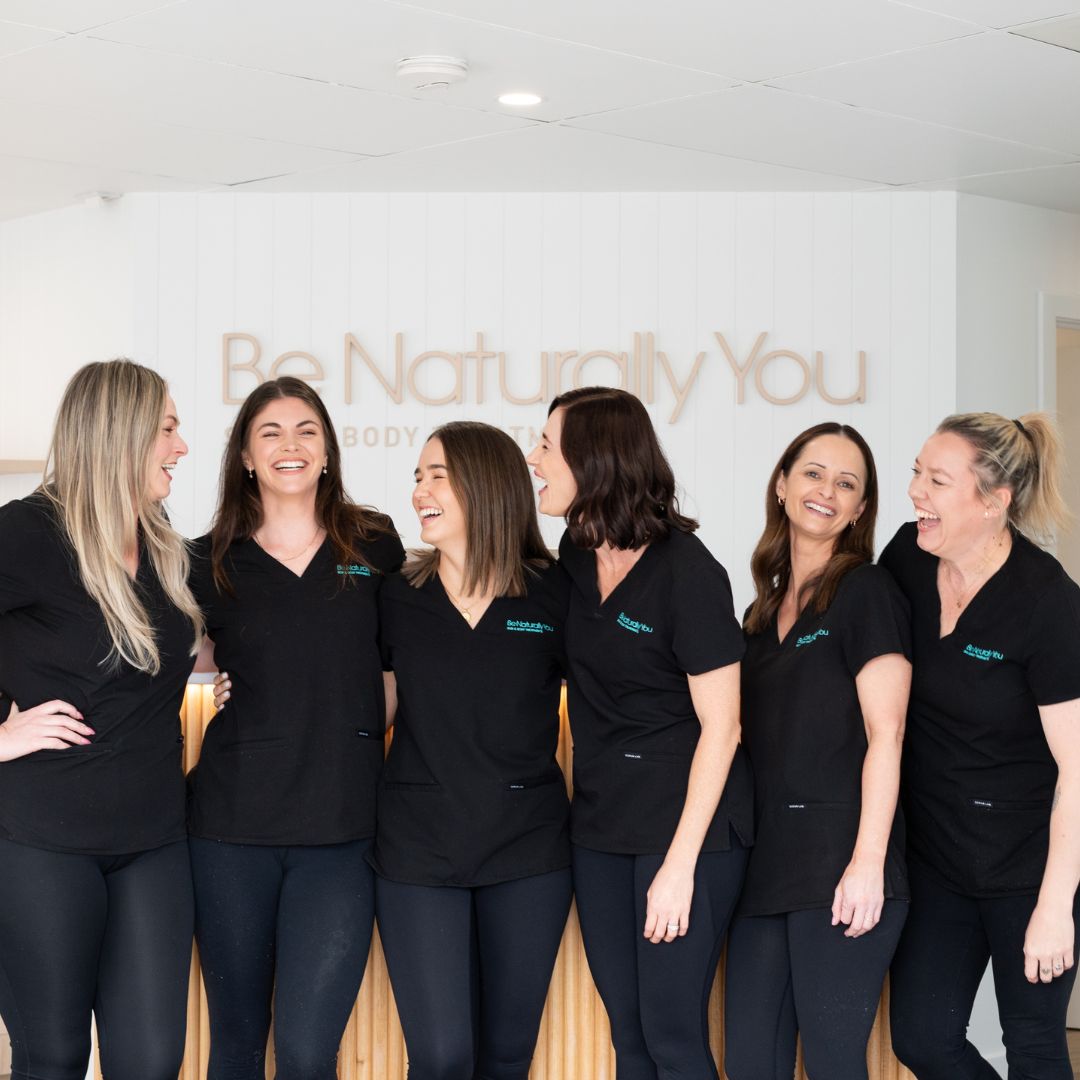 Group photo of the team smiling and laughing