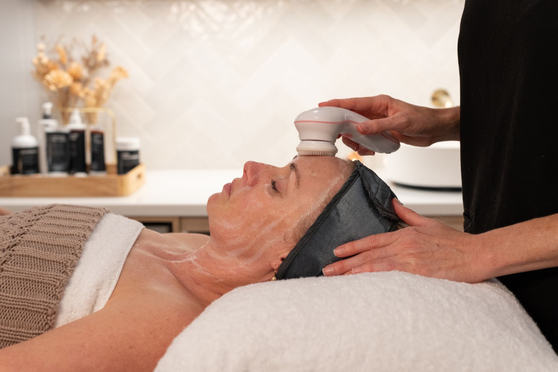 Woman receiving relaxation treatment in Palm Beach salon